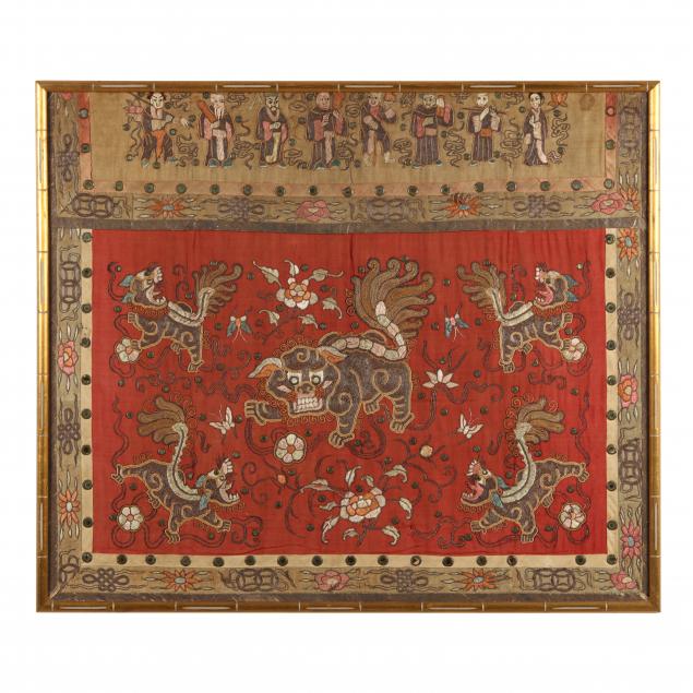 A CHINESE RED GROUND SILK EMBROIDERED