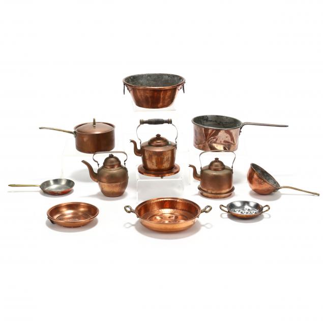  A GROUPING OF TWELVE COPPER COOKWARE