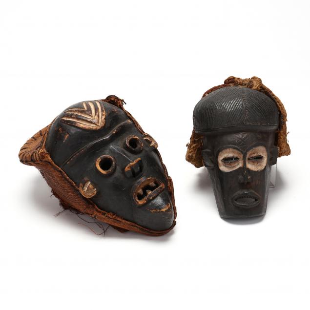 TWO WEST AFRICAN MASKS One attributed 2f0184