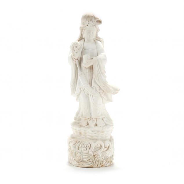 A CHINESE STYLE CARVED MARBLE GUANYIN