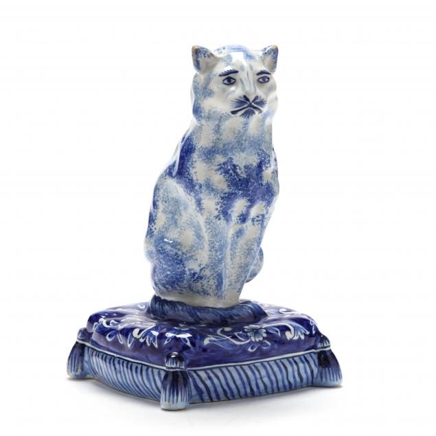DUTCH DELFT BLUE AND WHITE SEATED