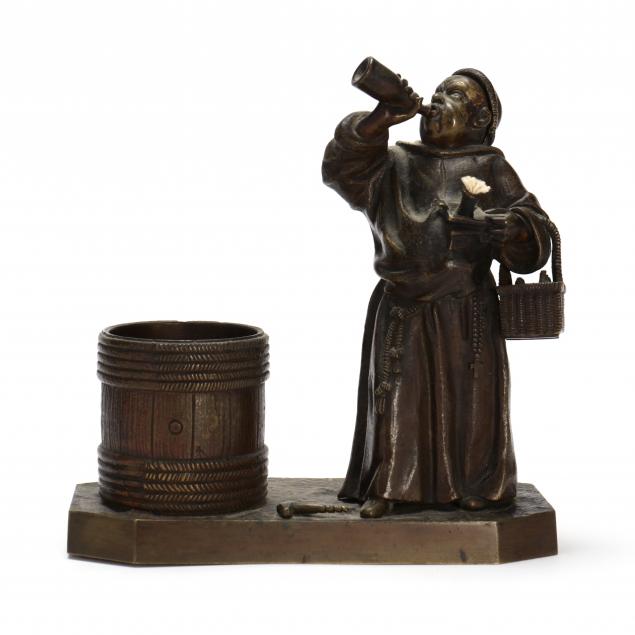 BRONZE CIGARETTE HOLDER AND FIGURAL