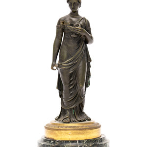 An Empire Patinated Bronze and
