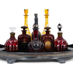 Eight Colored Glass Decanters and