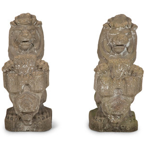 A Pair of Cast Cement Lions Holding 2f4bd1