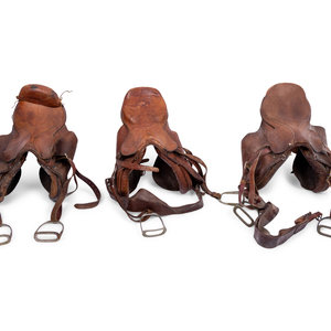 A Group of Three Leather Saddles, Including