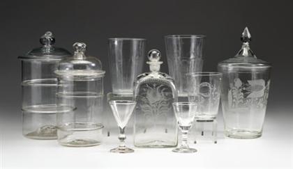 Nine uncolored blown glassware items