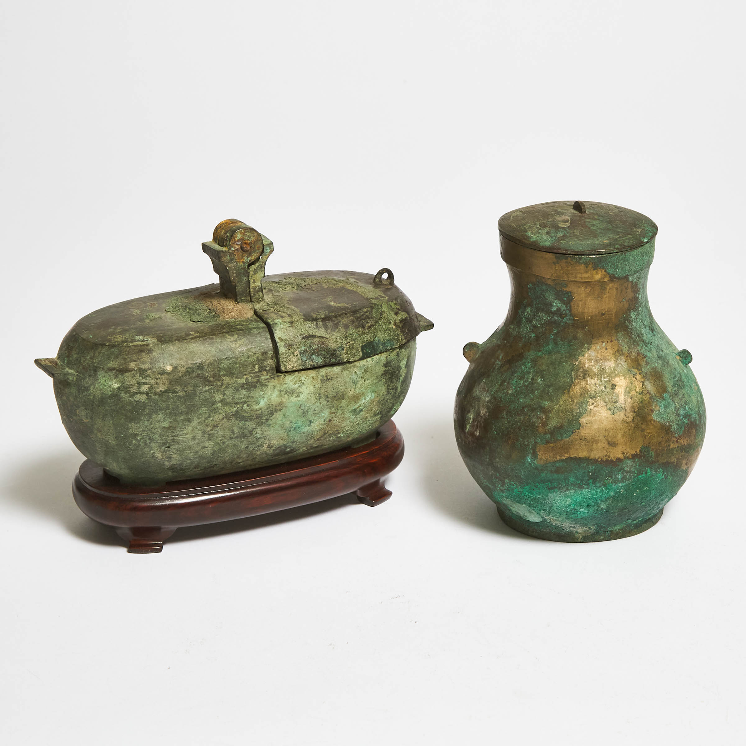 A Bronze Oil Lamp, Together With