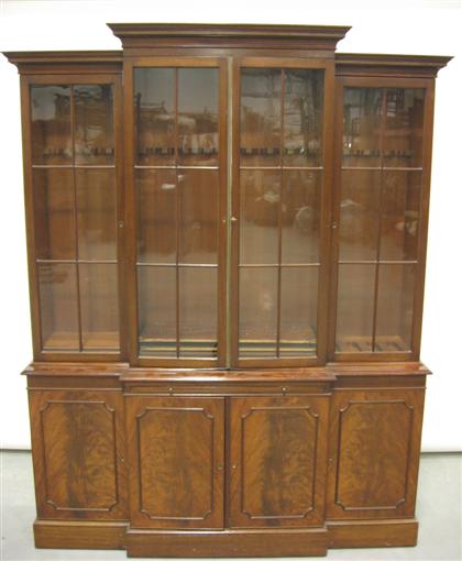 Mahogany gun cabinet in the form of