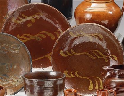 Two slip-decorated redware dishes