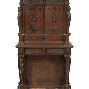 An Italian Carved Walnut Cabinet