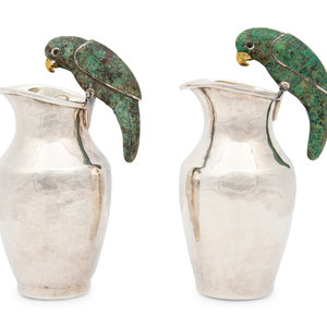 A Pair of Los Castillo Silver Pitchers
with