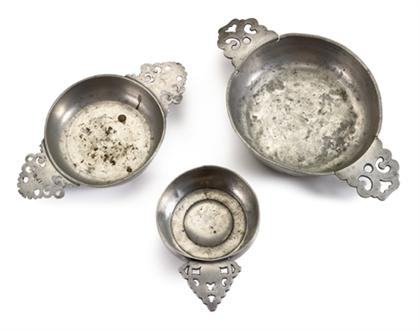 Group of three pewter porringers   