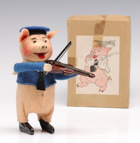 A SCHUCO WIND UP PIG WITH FIDDLE 2f5596