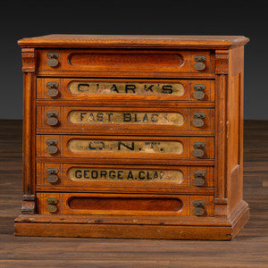 A Six-Drawer Oak Spool Cabinet
George