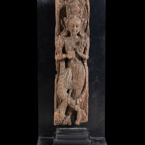 An Indian Carved Wood Figure of a Deity
one