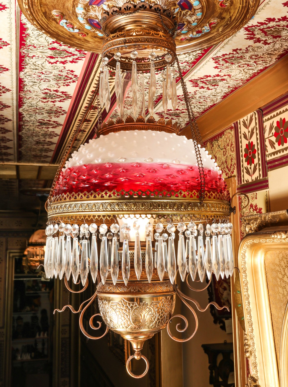 A HANGING LIBRARY LAMP WITH RUBINA HOBNAIL