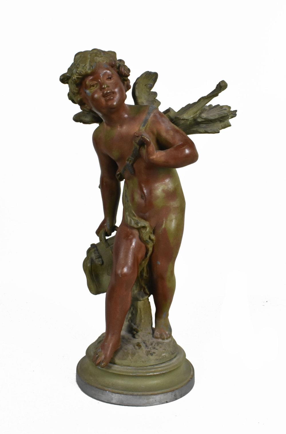 A SPELTER PATINATED FIGURE OF CUPID