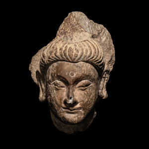 A Gandharan Grey Schist Head of Buddha
3rd