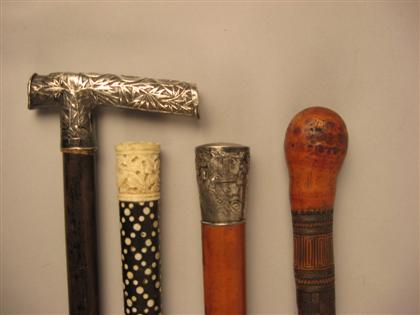 Group of four Asian walking sticks 