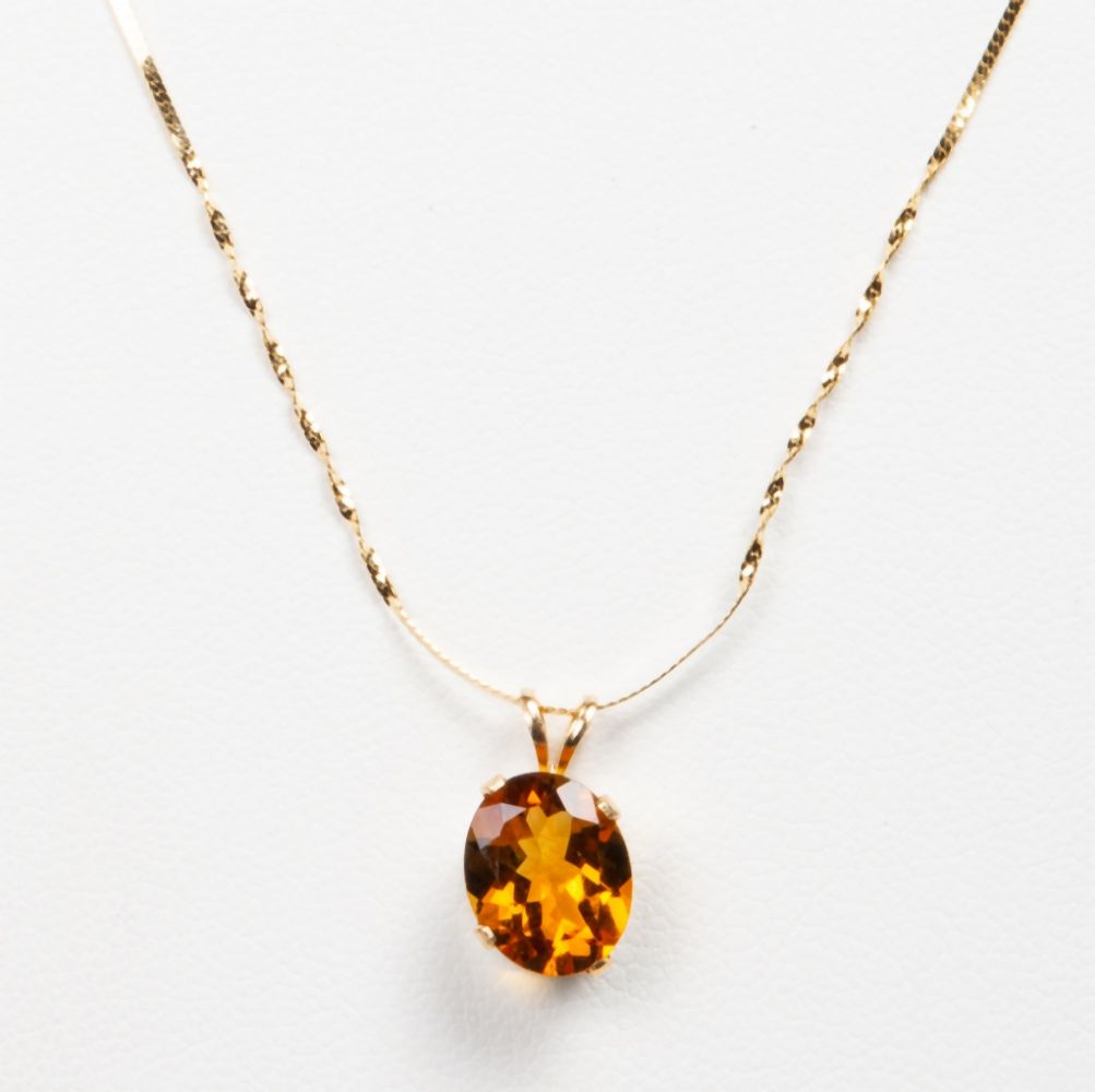 14K GOLD 1.80CT. OVAL MADEIRA CITRINE