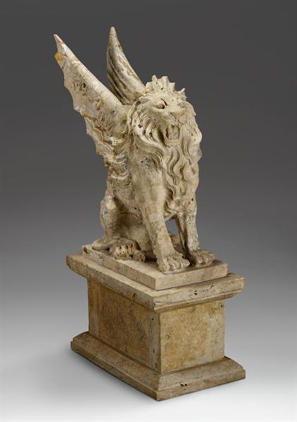 Carved travertine figure of a winged 4c315