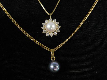 Two pearl pendants    14 karat