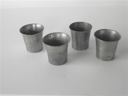 Four pewter beakers one bearing 4c8b7