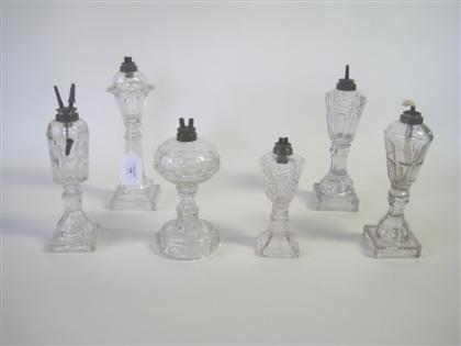 Six uncolored and pressed glass