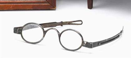 Pair of silver folding eye glasses