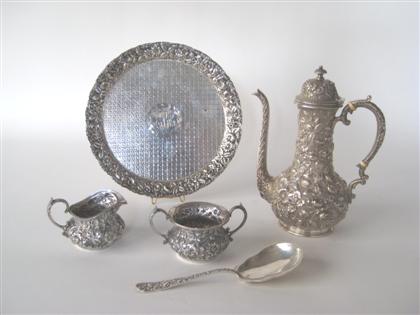 C  	Sterling repousse four-piece