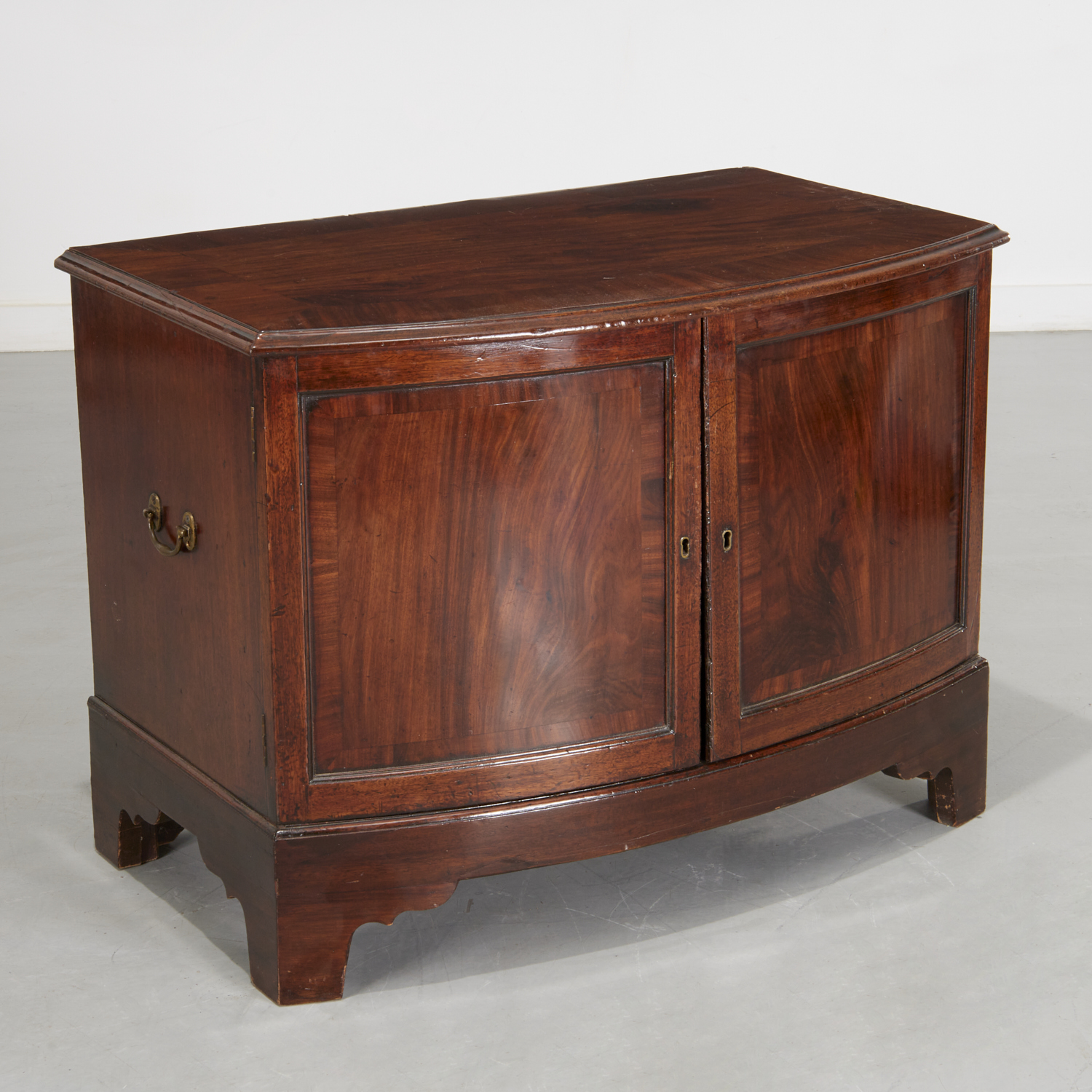 GEORGE III MAHOGANY BOW FRONT CABINET