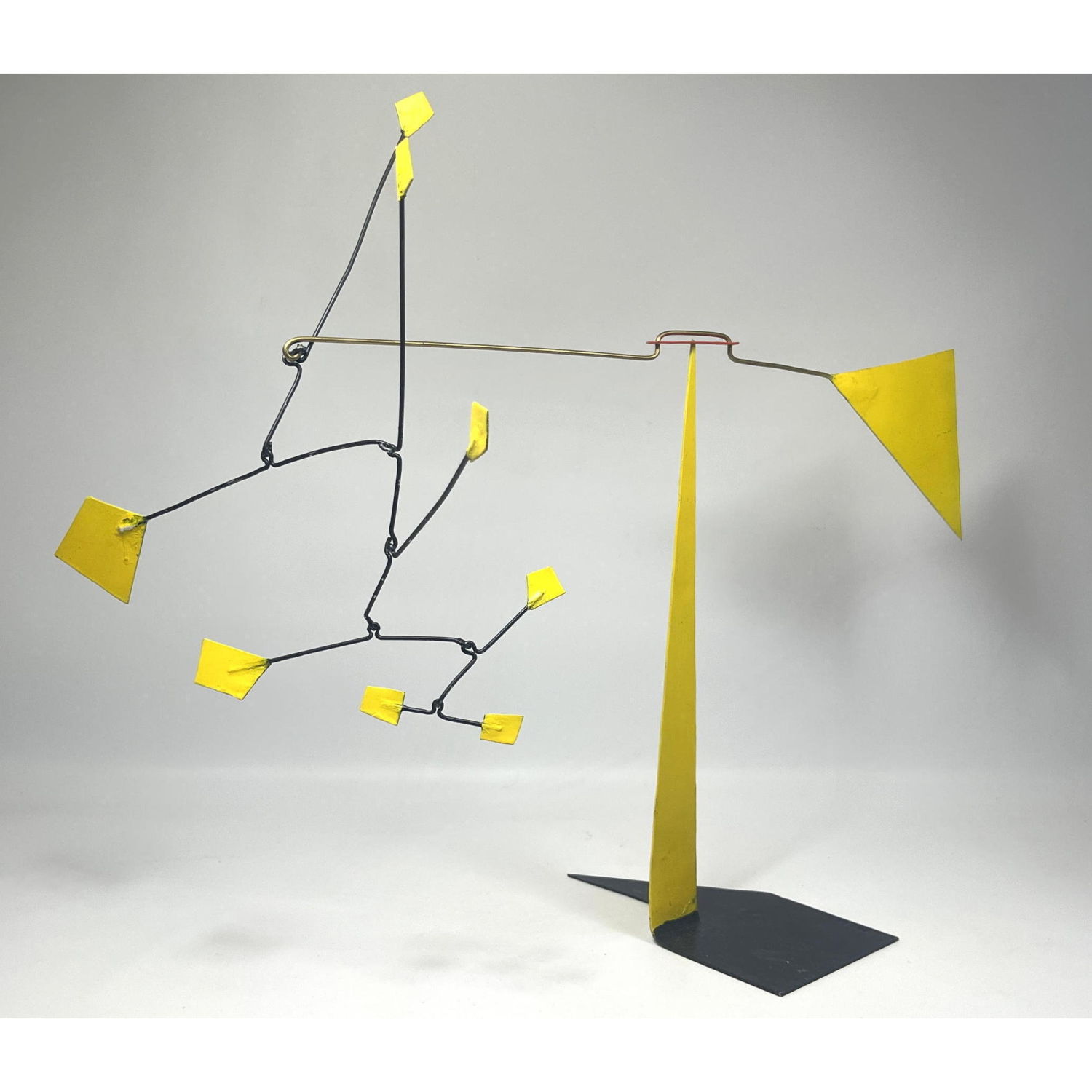 Yellow steel mobile kinetic sculpture