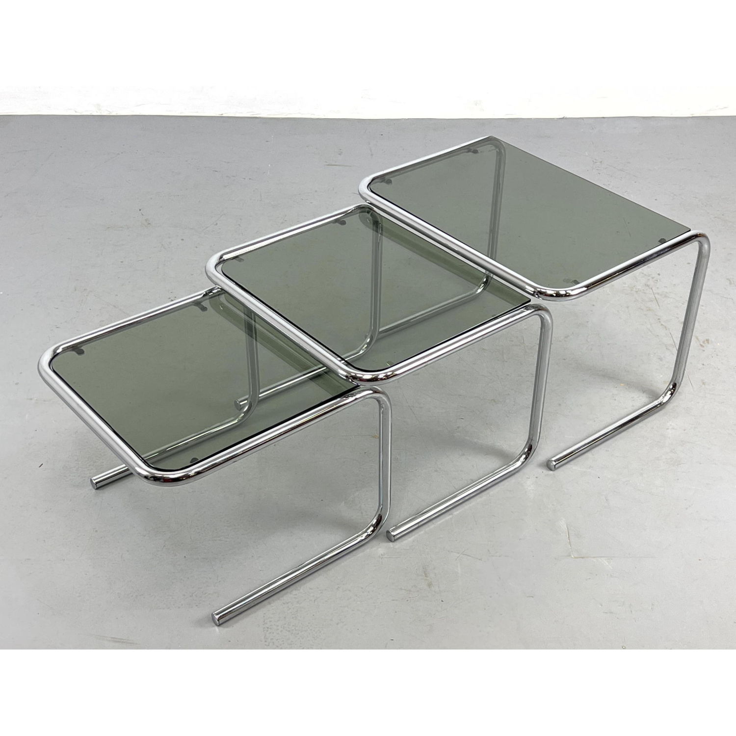 Chrome nesting table with tinted