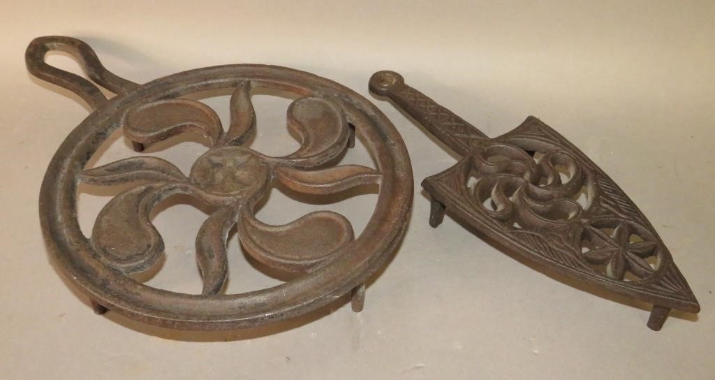 2 CAST IRON TRIVETSca. 1820-1860;