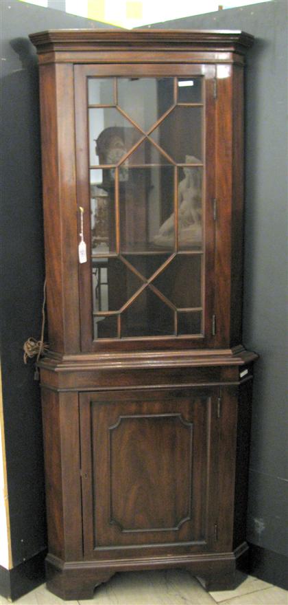 Pair of mahogany corner cupboards