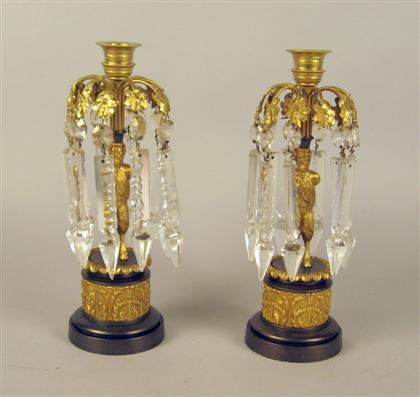Two pairs of French gilt bronze candlesticks