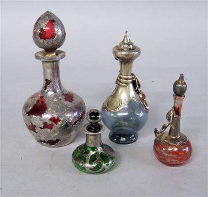 Four silver overlay scent bottles 4caed