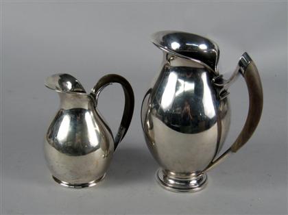Two Continental silver cream jugs