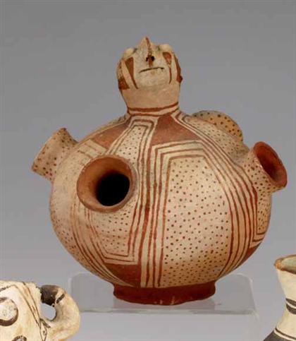 Mohave effigy jar    Globular body