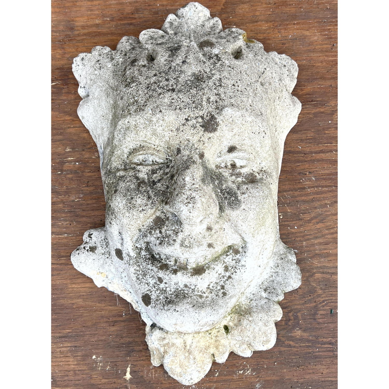 Large cast concrete face wall hanging.