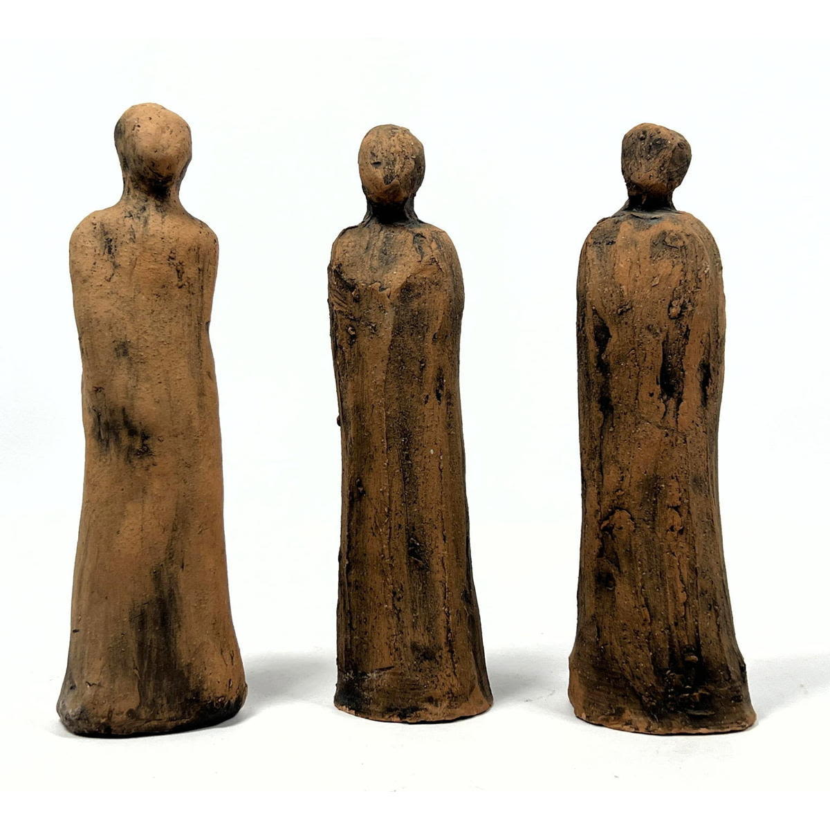 Three modernist terracotta sculptures.
