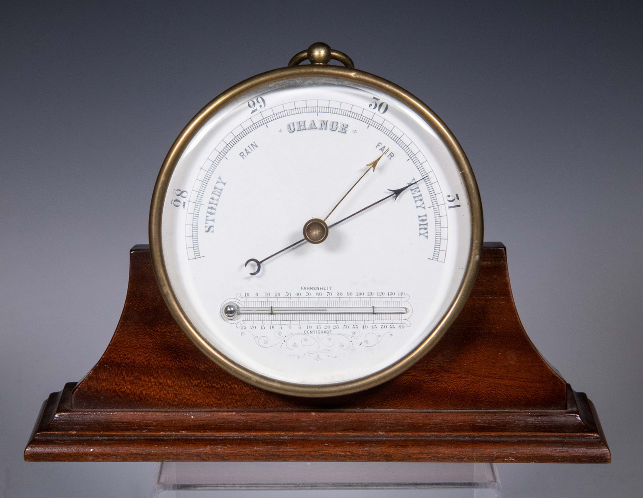 BRASS CASED ANEROID BAROMETER ON