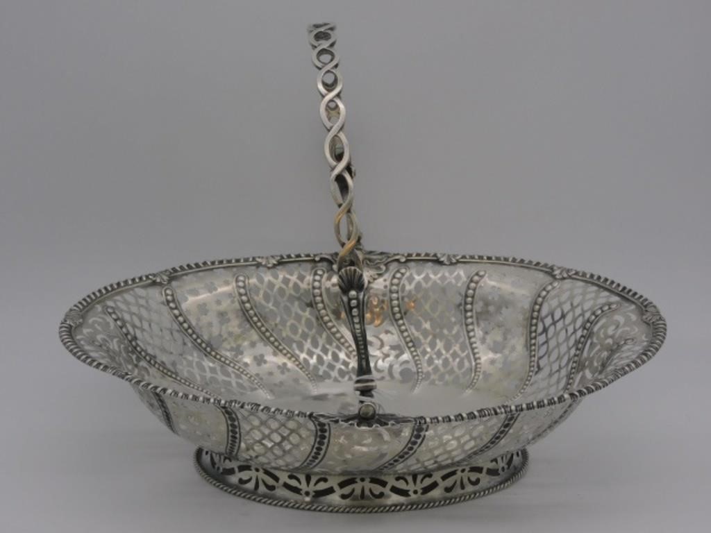 ENGLISH SILVER SWING HANDLED FOOTED