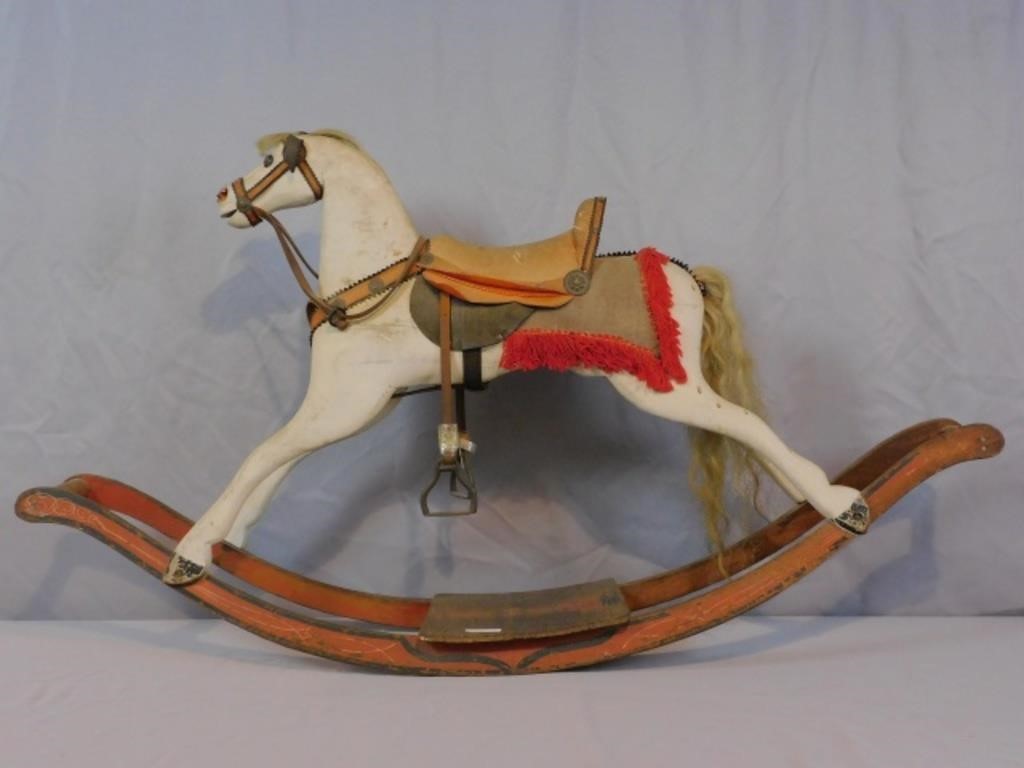 CARVED AND PAINTED ROCKING HORSE,