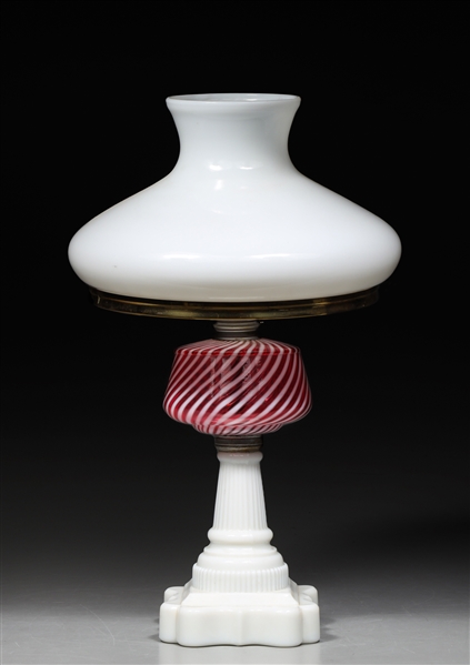 Antique milk-glass table lamp with pink