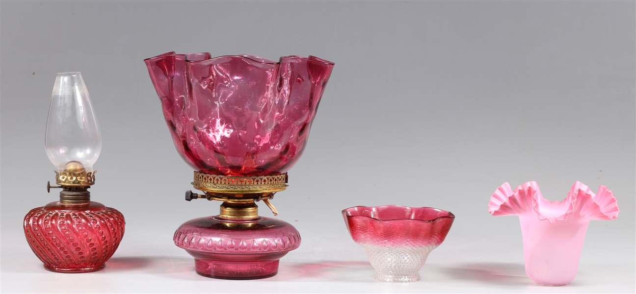 Group of four antique pink glass