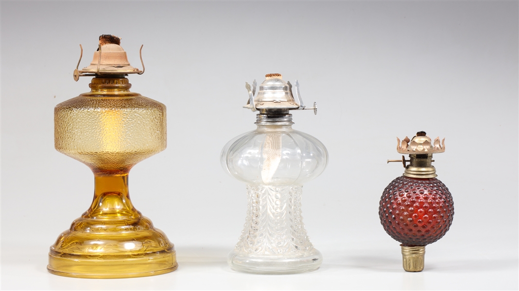 Group of three vintage kerosene lamps;