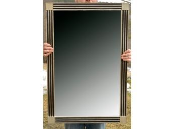 A contemporary wall mirror, by