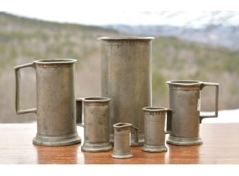 A set of six graduated pewter measures,